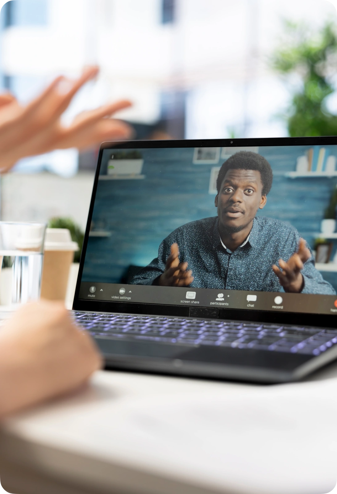 A professional attending an online video session with an instructor